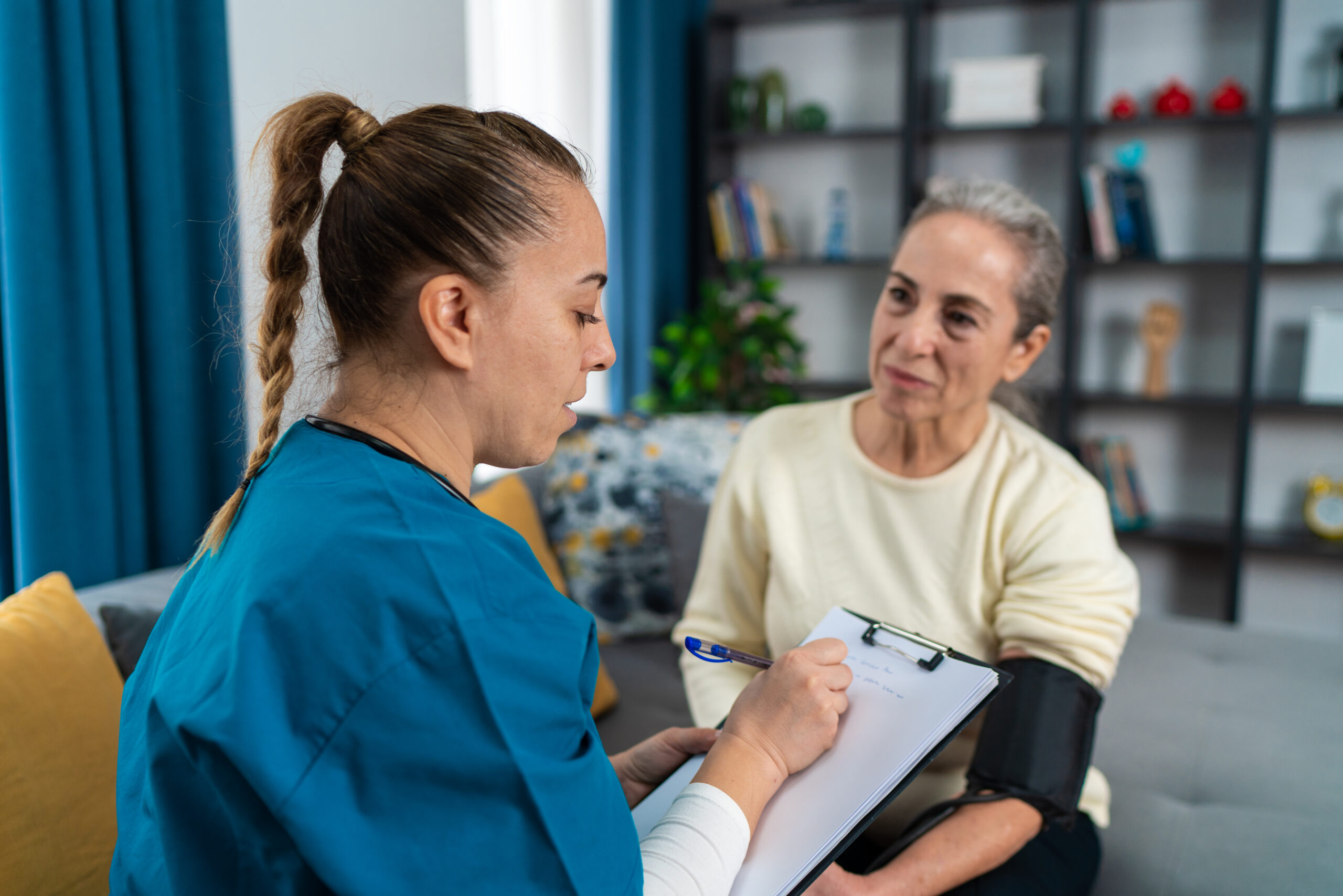 Home health nurse providing care for patient